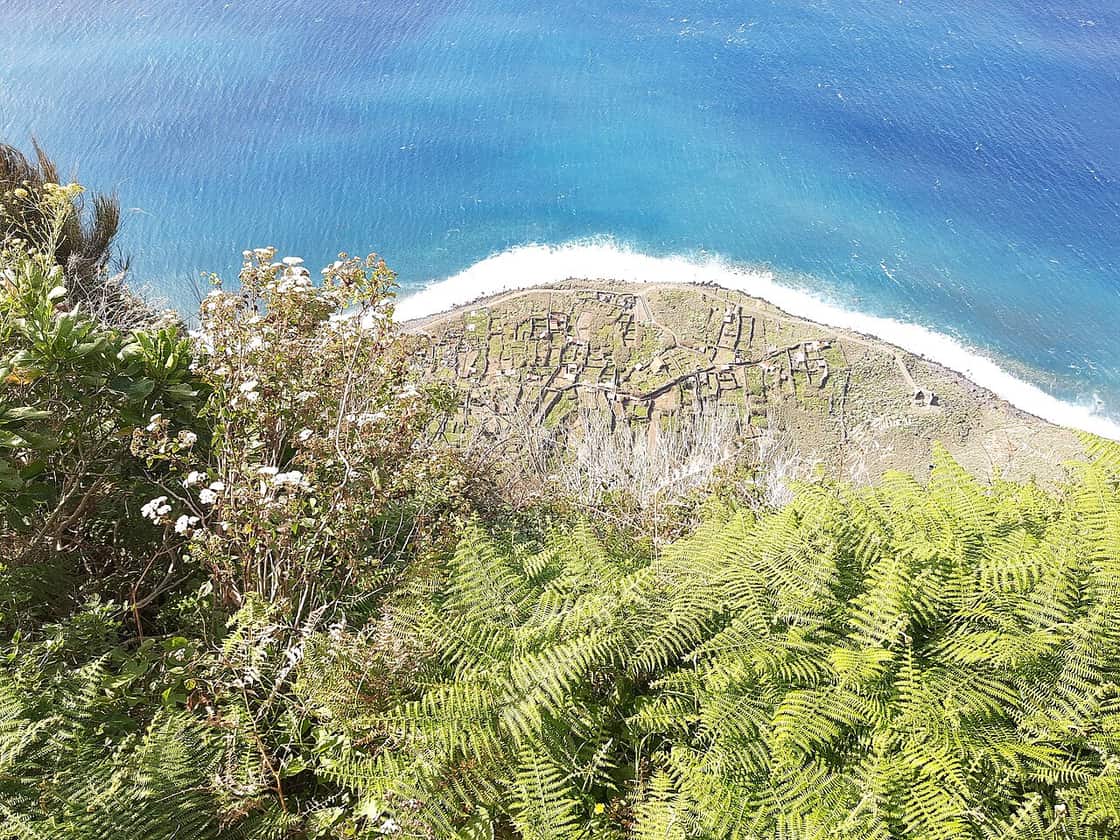 Fields below the cliffs at Achadas da Cruz, showing the steep descent toward the coast.