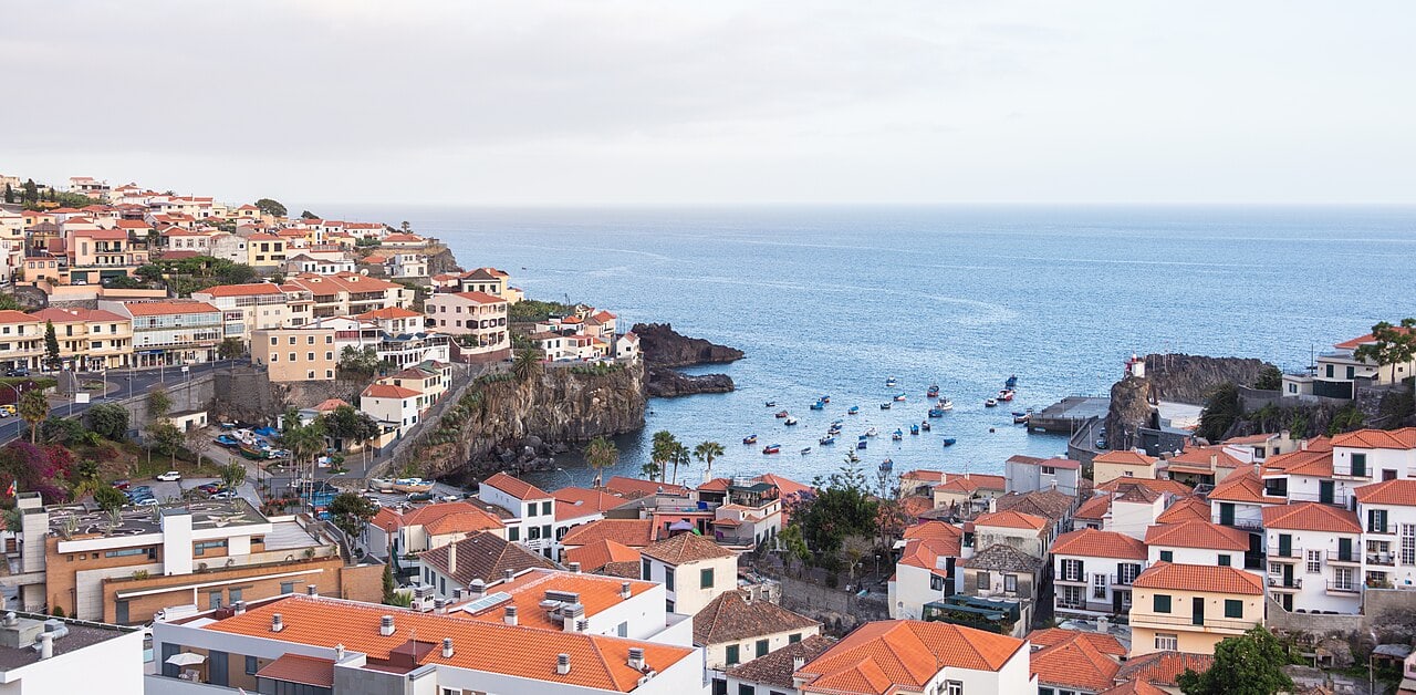Red roofs surround Câmara de Lobos bay, with the waterfront below for a walk through the fishing town.